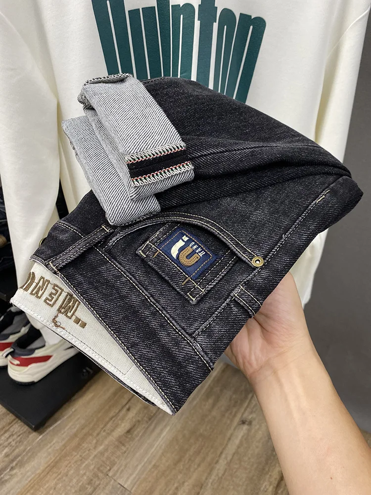 

2025 autumn new trend street small leg jeans men, simple and versatile, elastic tapered long pants