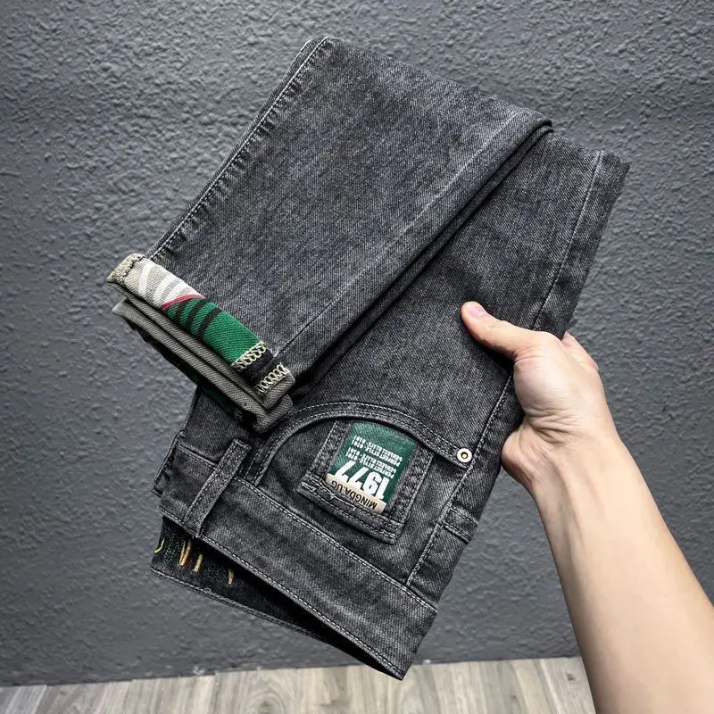 الاتجاه الأصلي الربيع والصيف رقيقة الرجال سليم المناسب مطاطا الراقية السراويل الجينز أقدام صغيرة جديد طويل العلامة التجارية الشارع الشهير السراويل