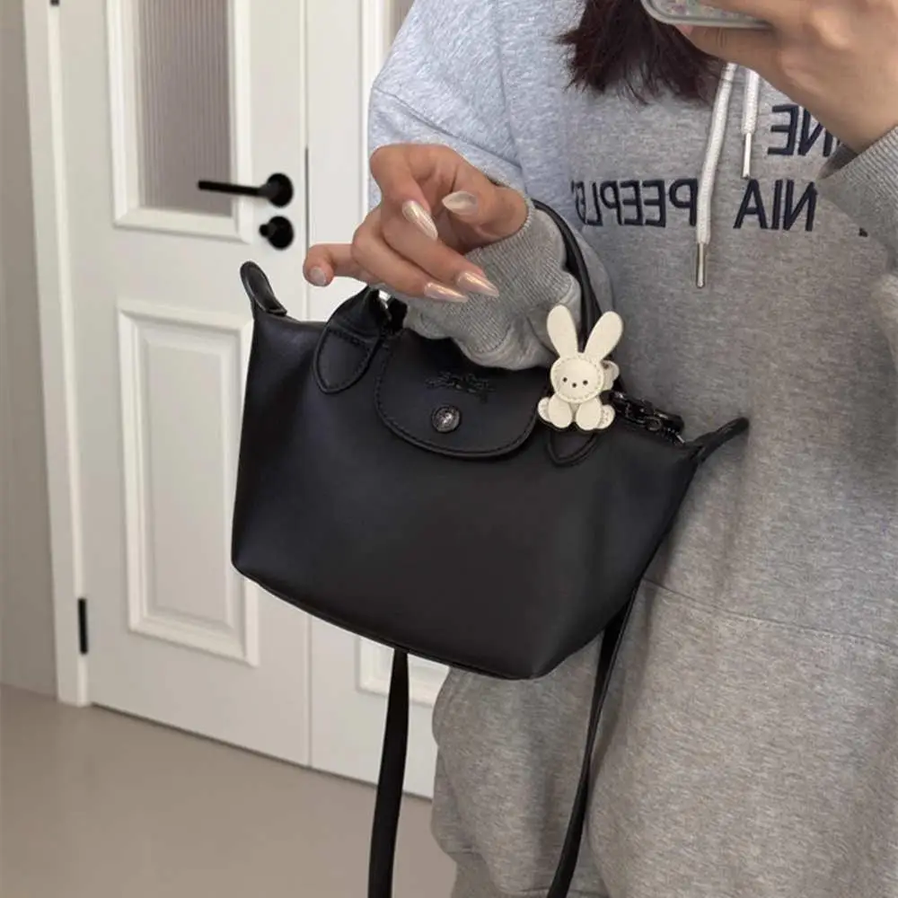 2025 لطيف الأرنب قلادة حقيبة سلسلة مفاتيح الحلي لطيف الجلود حقيبة ساحرة اكسسوارات الديكور كيرينغ الفتيات الهدايا اليدوية