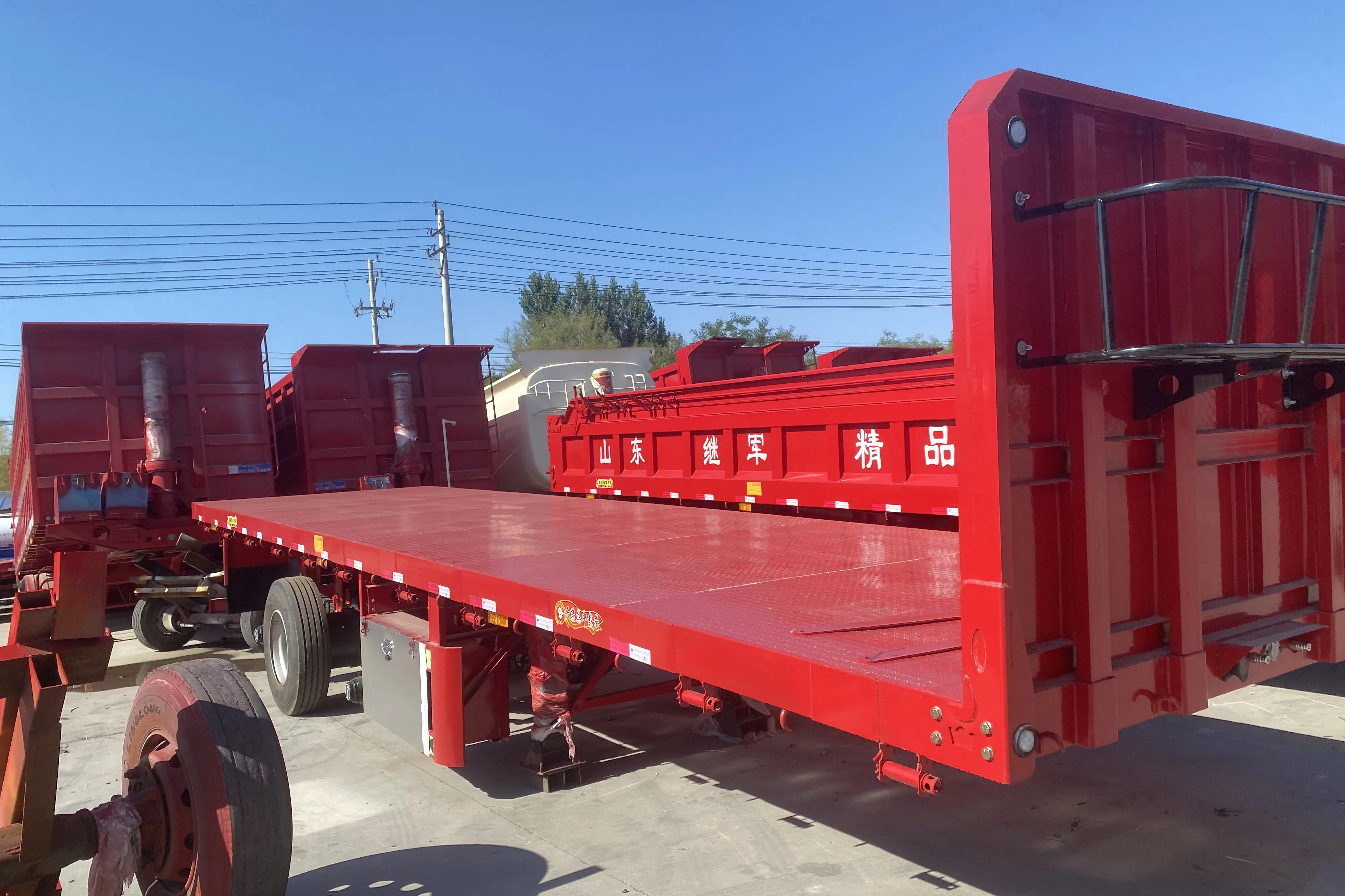 JKG45Ft 40Ft سعر المصنع نصف مقطورات فولاذية 3 محاور سرير مسطح مقطورة مسطحة للبيع