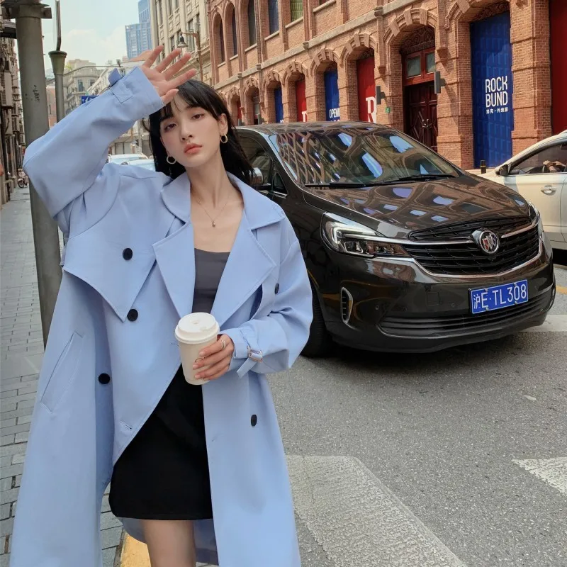 A new youthful versatile comfortable and skin-friendly mid-length women's trench coat that reaches the knees