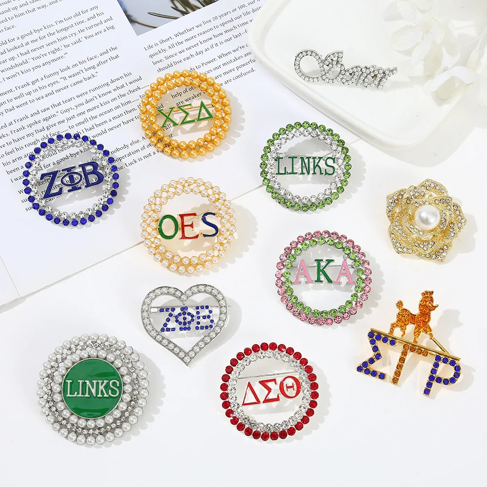 Foreign trade popular circular hollow alloy OES Greek Friendship Association letter anti light brooch pin wholesale
