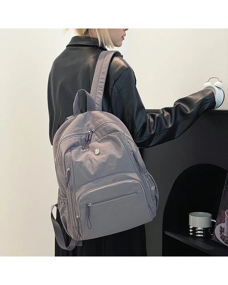 

Light blue multi zipper casual backpack lightweight water resistant fabric suitable for students daily school use and casual