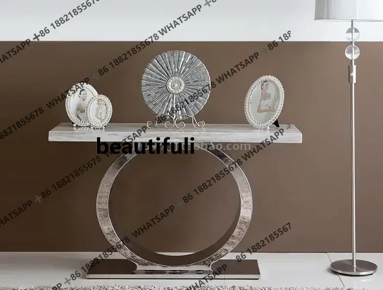 Light luxury stainless steel marble entrance table against the wall, modern simple and fashionable sofa back