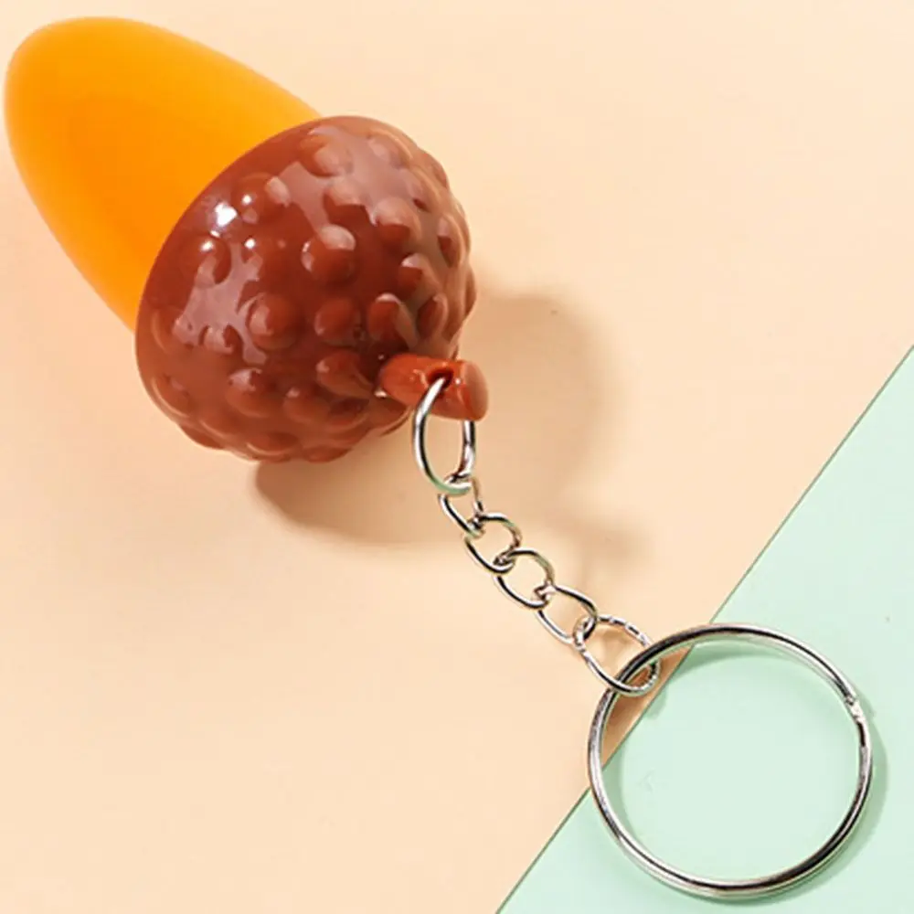 ปากกาลูกลื่นรูปทรงกรวยสนสร้างสรรค์ปากกาลูกลื่นแบบยืดหดได้พวงกุญแจทรงกรวยกล้องส่องทางไกลขนาดเล็กรางวัลของขวัญเล็กๆ