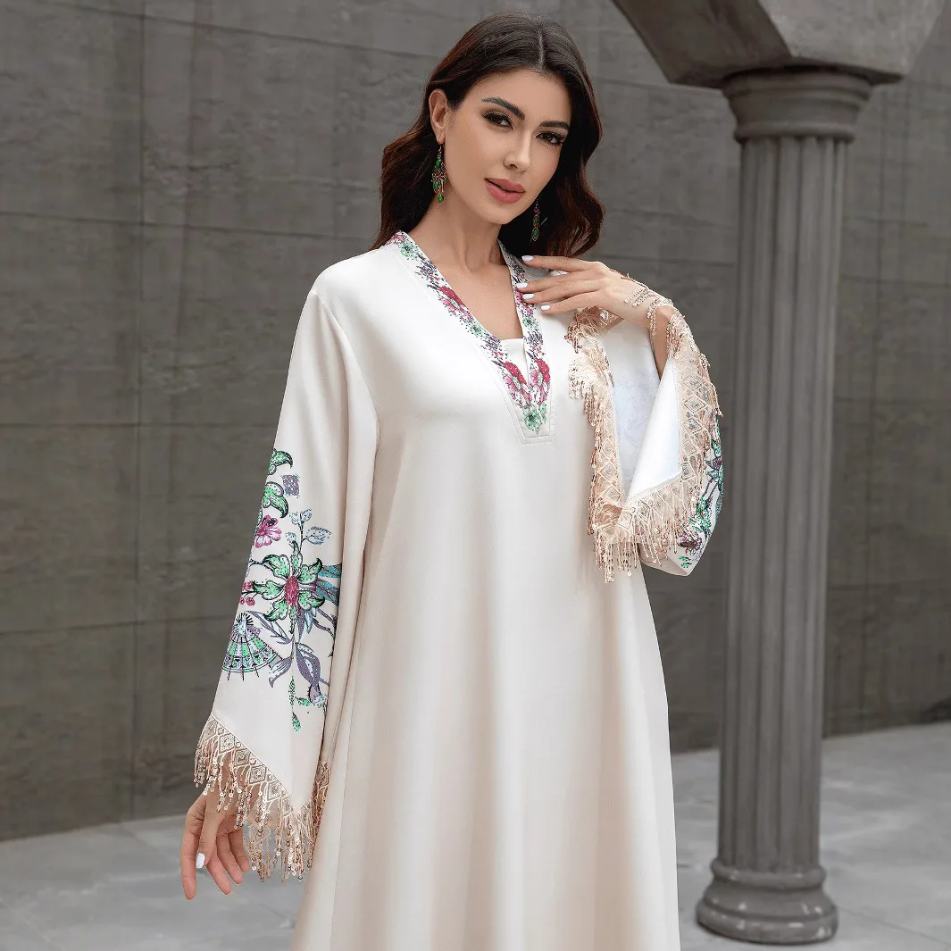 Dubai Muslim women's abaya. It is a fashionable and elegant dress in Arabic style with a V-neck embroidered patterns and tassels