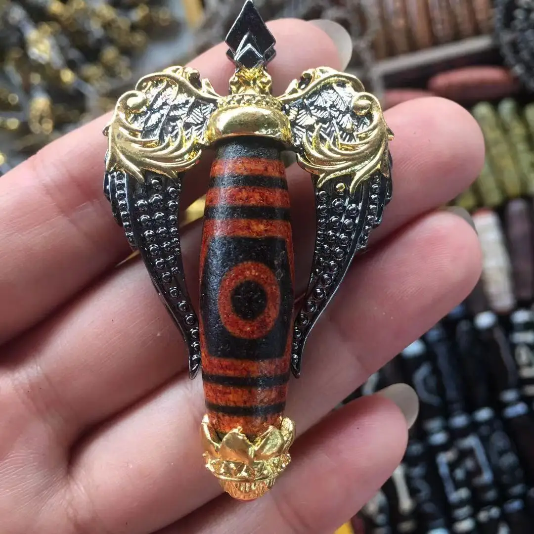 

Wholesale wenwan Tibetan inlaid dzi beads pendant pattern Taiwan Province craft high oil patina inlaid dzi beads for men and