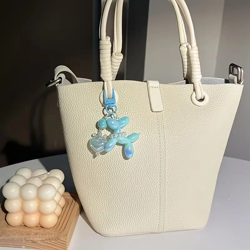One new-style creative balloon dog. With a heart-shaped crown design. Suitable for bags, wallets, and car keychains as decoratio