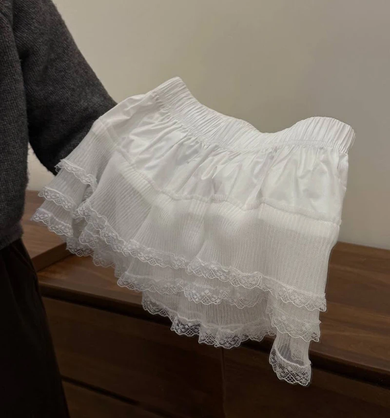 Falda de media capa con ribete de encaje INS, ropa de capas blancas a la moda para mujer, falda corta envolvente de corte a de Lolita dulce para primavera, ropa de calle