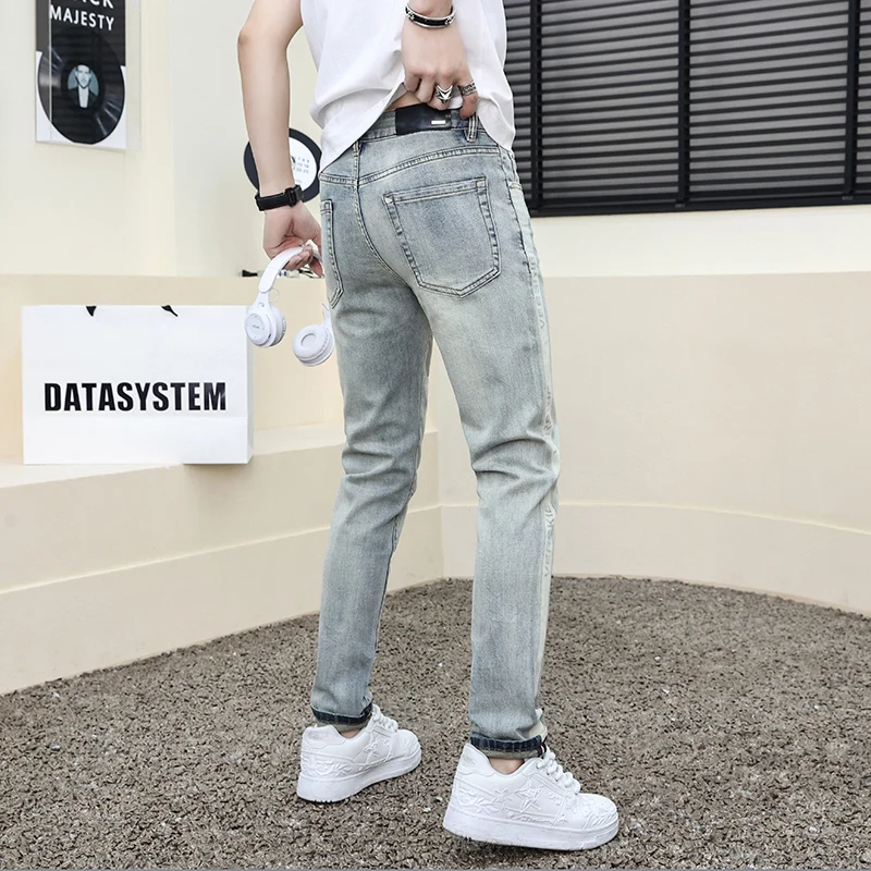 Jeans magro estampado azul claro masculino, calça elástica de alta qualidade, ajuste justo, design de buraco quebrado, moda nova, 2024