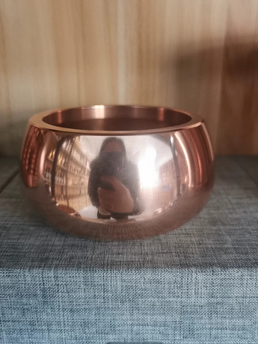 copper alms bowl