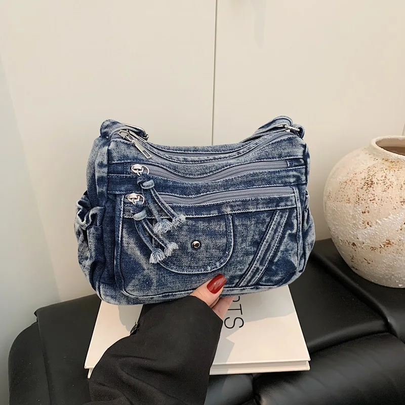 Bolso de mezclilla azul retro estilo urbano 2026, mochila de nicho multibolsillos para mujer, bandolera de hombro para combinar con estilo, bolso Ita de moda