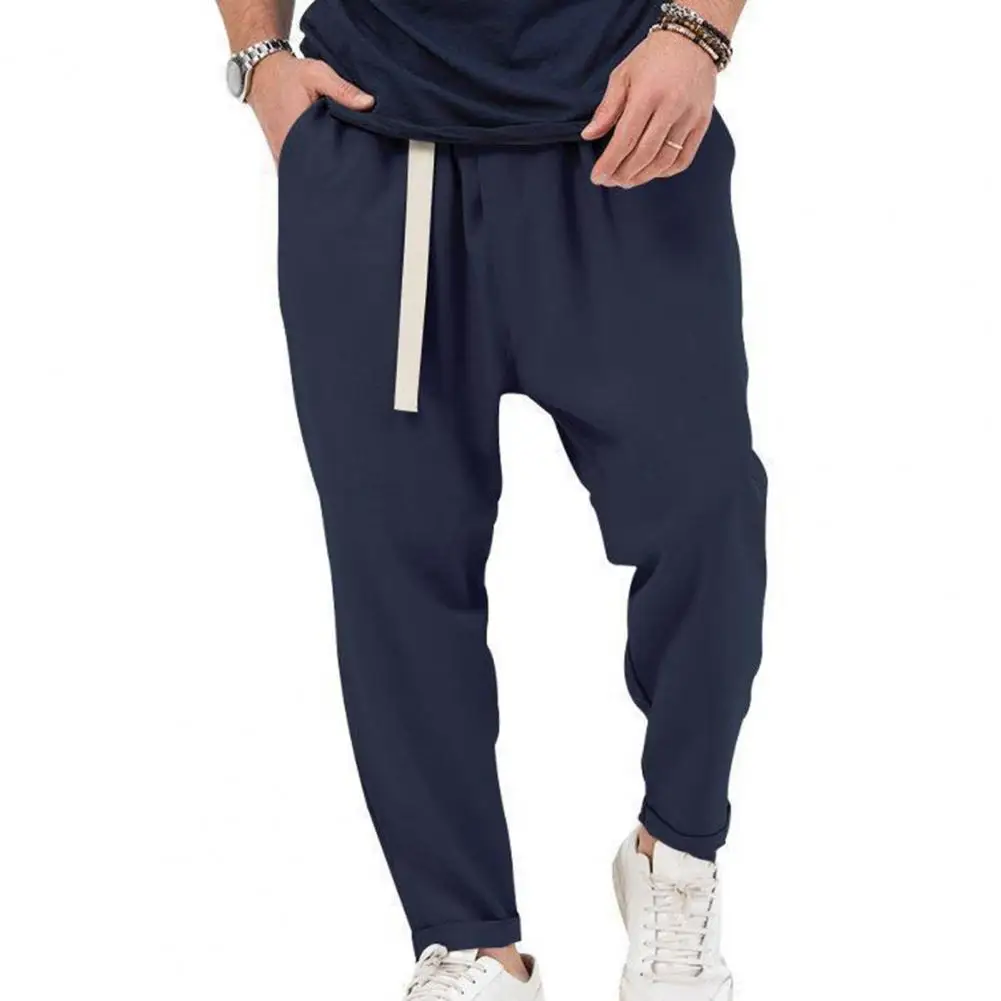 Pantalones holgados de cintura ajustable para hombre, pantalones de Color sólido, pantalones Harem de ajuste suelto con cinturón elástico, bolsillos para A