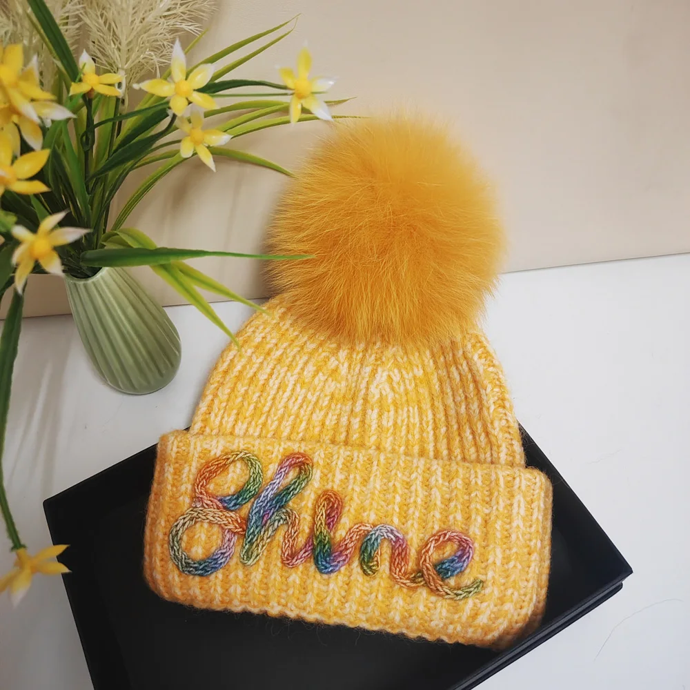 

Popular new color knitted wool hat Christmas fashion real fox fur ball ear protection warm hat skiing trip