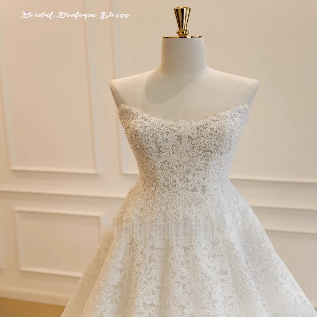 Maßgeschneidertes elegantes ärmelloses A-Linie-Hochzeitskleid mit Applikation, trägerlos, Sweep-Zug, Prinzessin-Brautkleid, Vestido De Novia