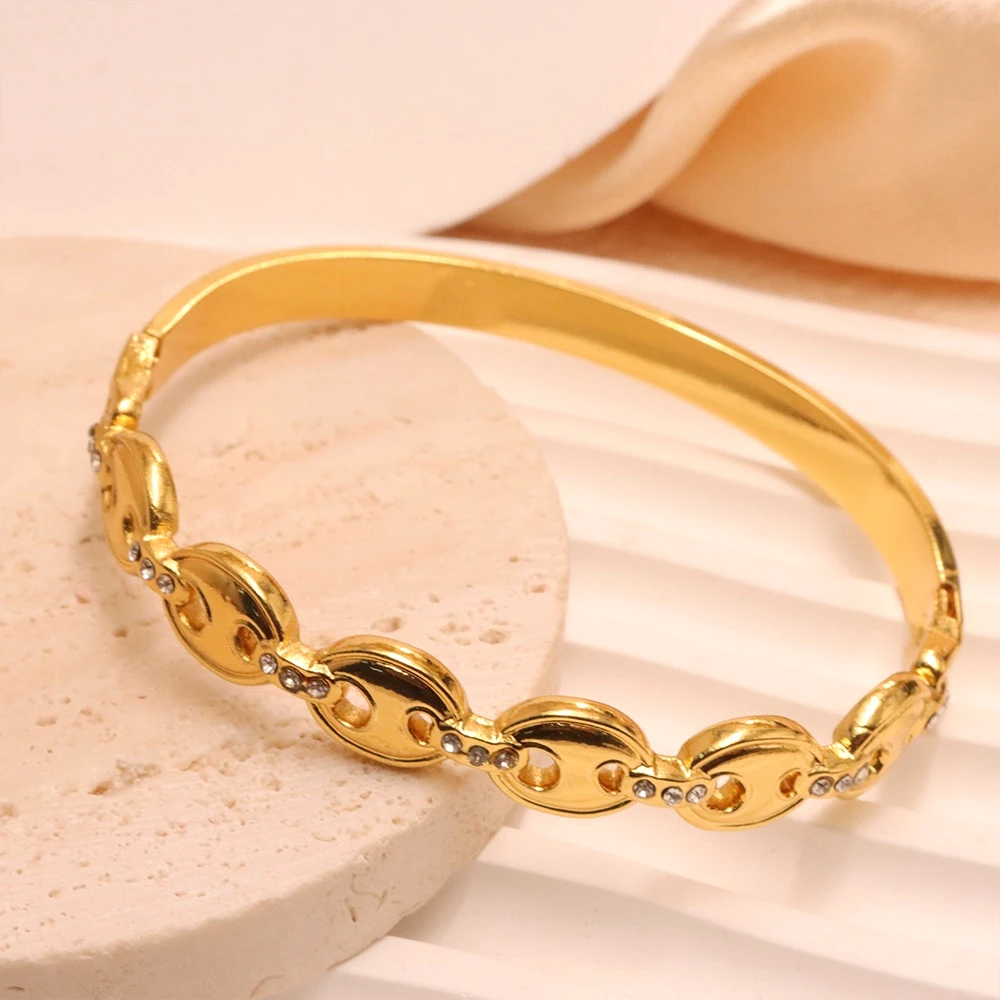 Elegant Gold Plated Stainless Steel Bangle with Openwork Zircon Pig Nose Design High-Quality Women's Fashion Bracelet