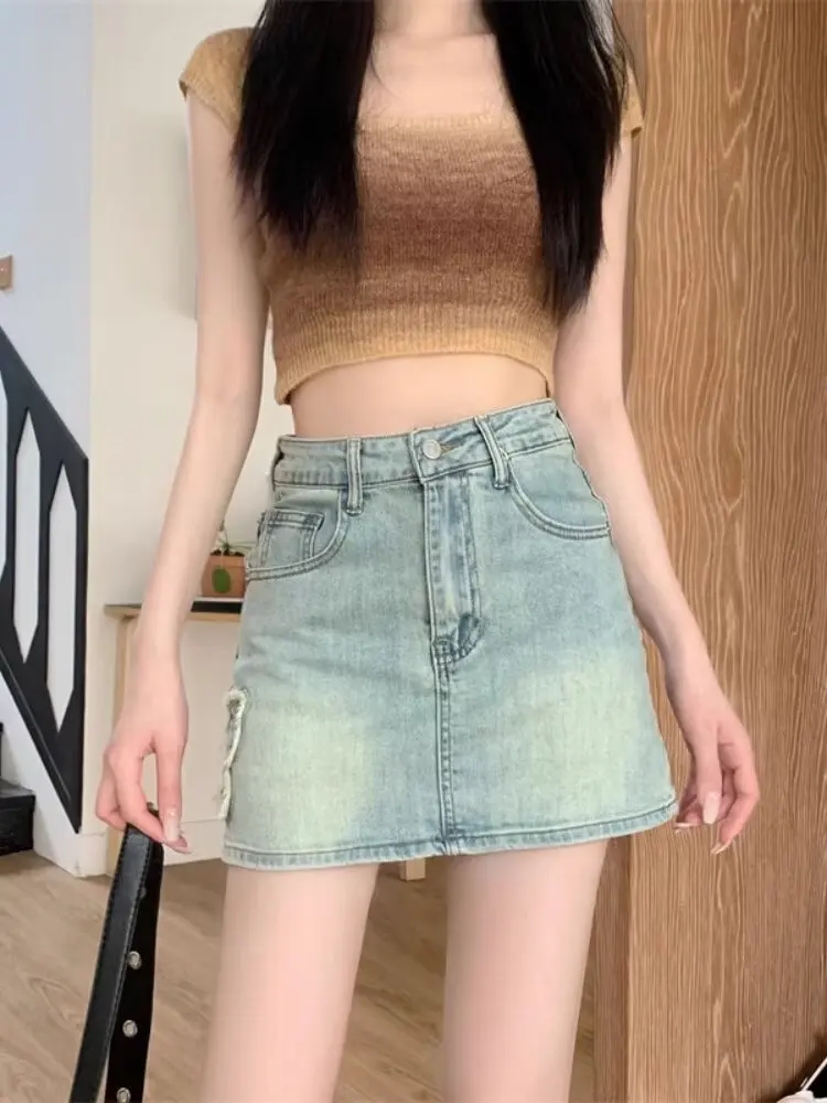 

Новые летние женские винтажные джинсовые юбки, корейская мода, тонкая мини-юбка с высокой талией, женская элегантная универсальная облегающая юбка трапециевидной формы