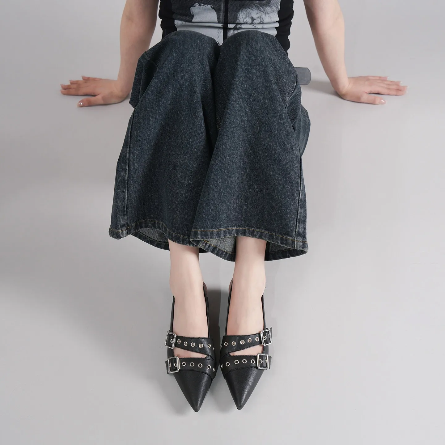 Pointed Black High Heels with A Unique Design, Metal Stud Accents, and A Single-strap Sandal Style