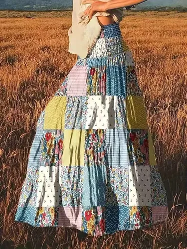2025 Ropa de mujer de retazos estampados de moda: falda media floral con diseño de falda larga de cintura alta