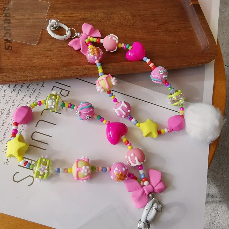 

_ Ремешок с коротким розовым бантом, ремешок с граффити-шариком, ремешок на запястье с защитой от потери, _ подвесной ремешок с зажимом, подвесная цепочка