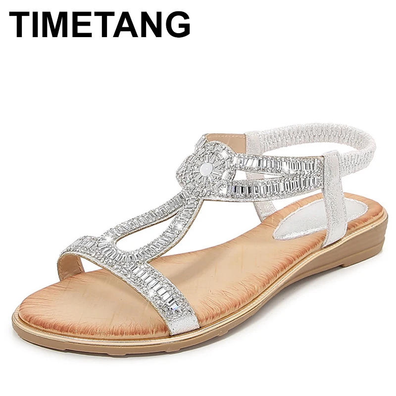 

Женские сандалии большого размера, пляжная одежда с открытым носком, новая весенняя обувь на плоской подошве с цветочным принтом и кристаллами, украшенная в римском стиле для взрослых