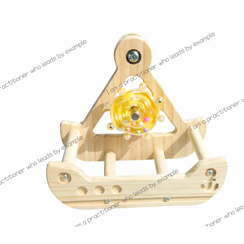 Parrot turns the toy pirate ship gnaws and relieves boredom, rocking the station pole stand