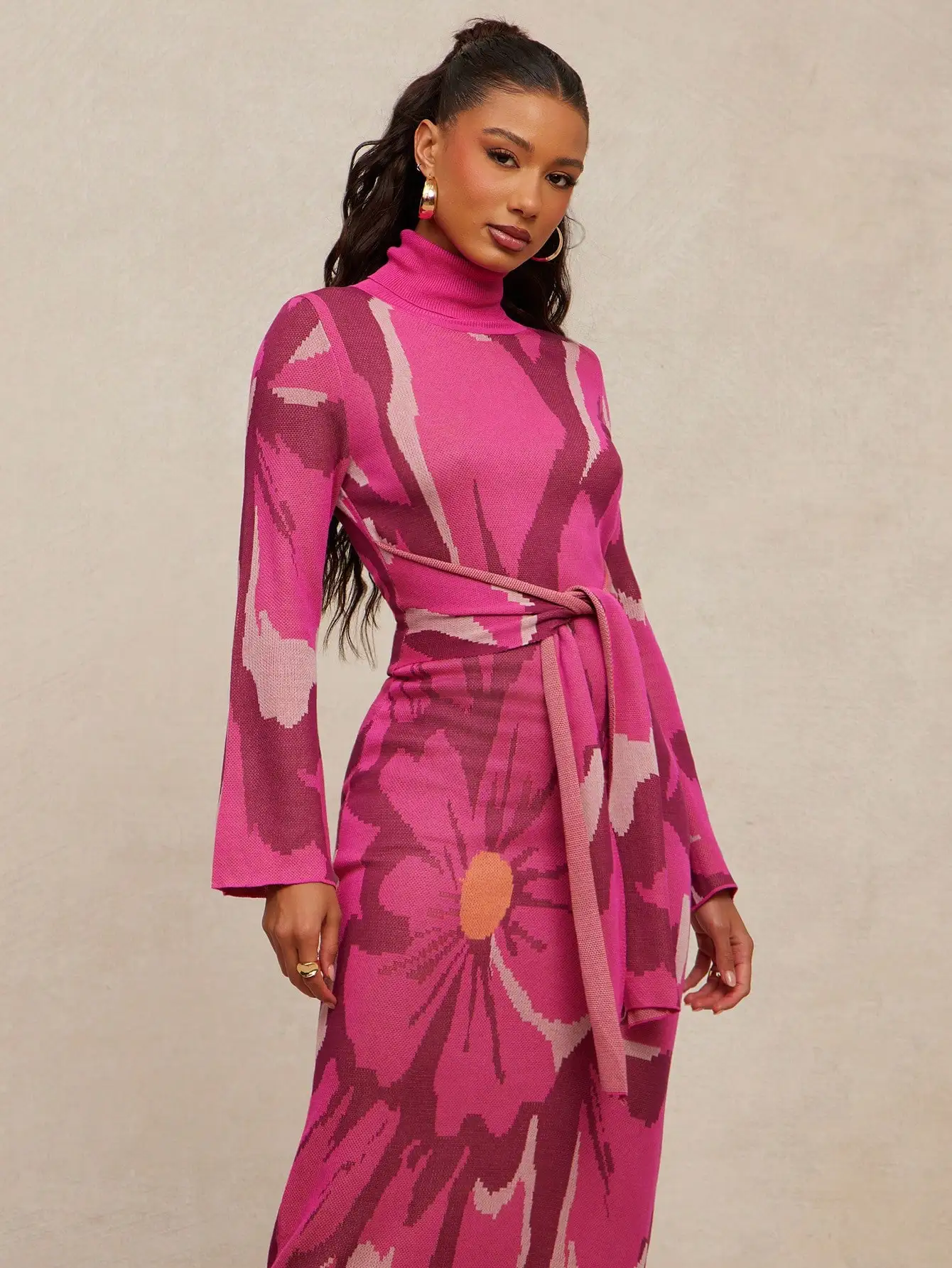 

Pink Floral Knit Maxi Dress with Turtleneck, Bell Sleeves & Self-Tie Waist