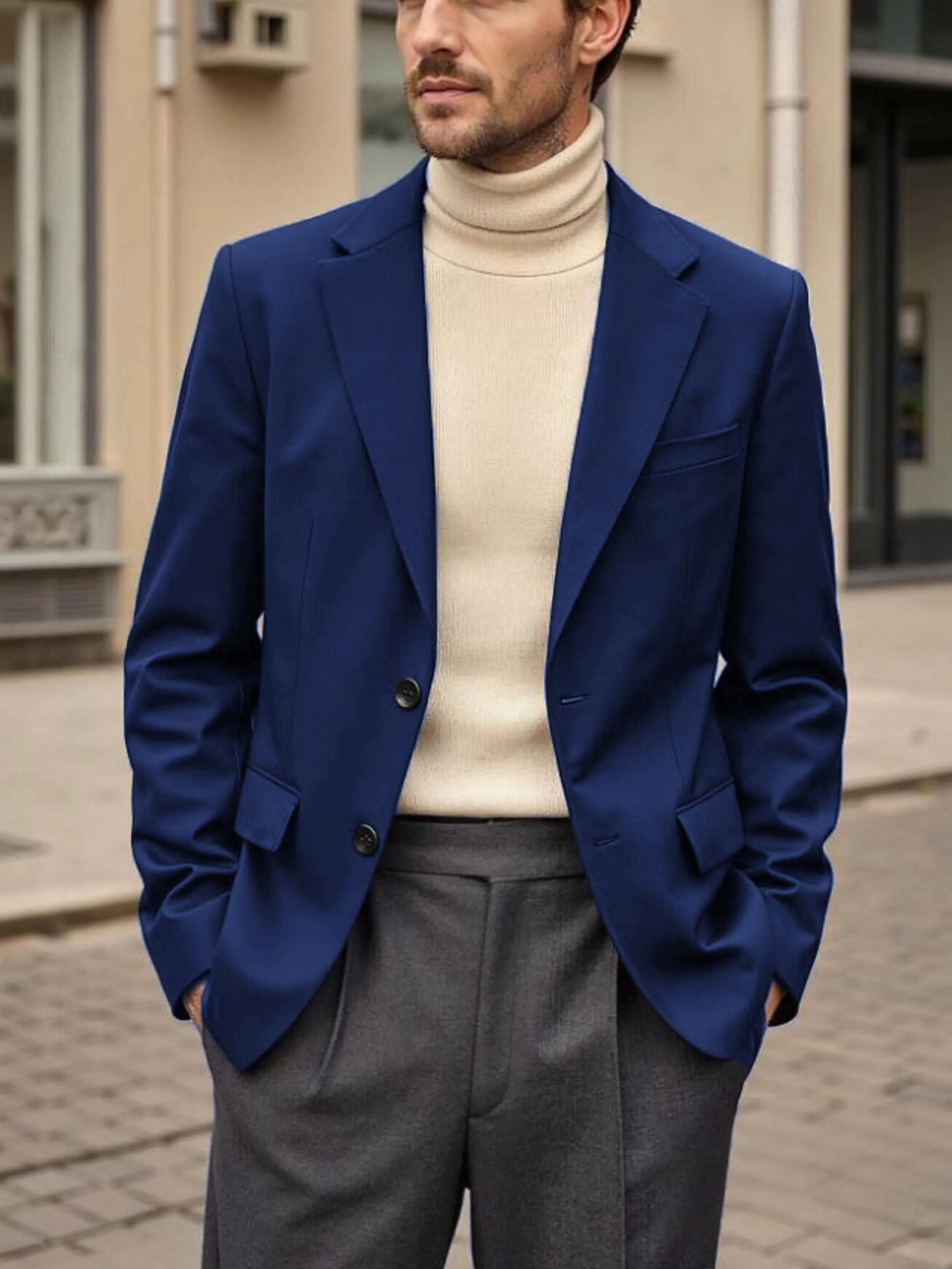 

A casual and stylish two-button navy blue suit jacket is suitable for men's outdoor wear in spring and autumn