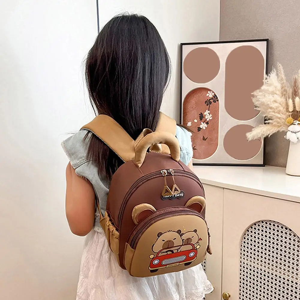 Simpatico zaino Capybara Borsa da scuola per studenti leggera in nylon Zaino per asilo multitasche di grande capacità per cartoni animati