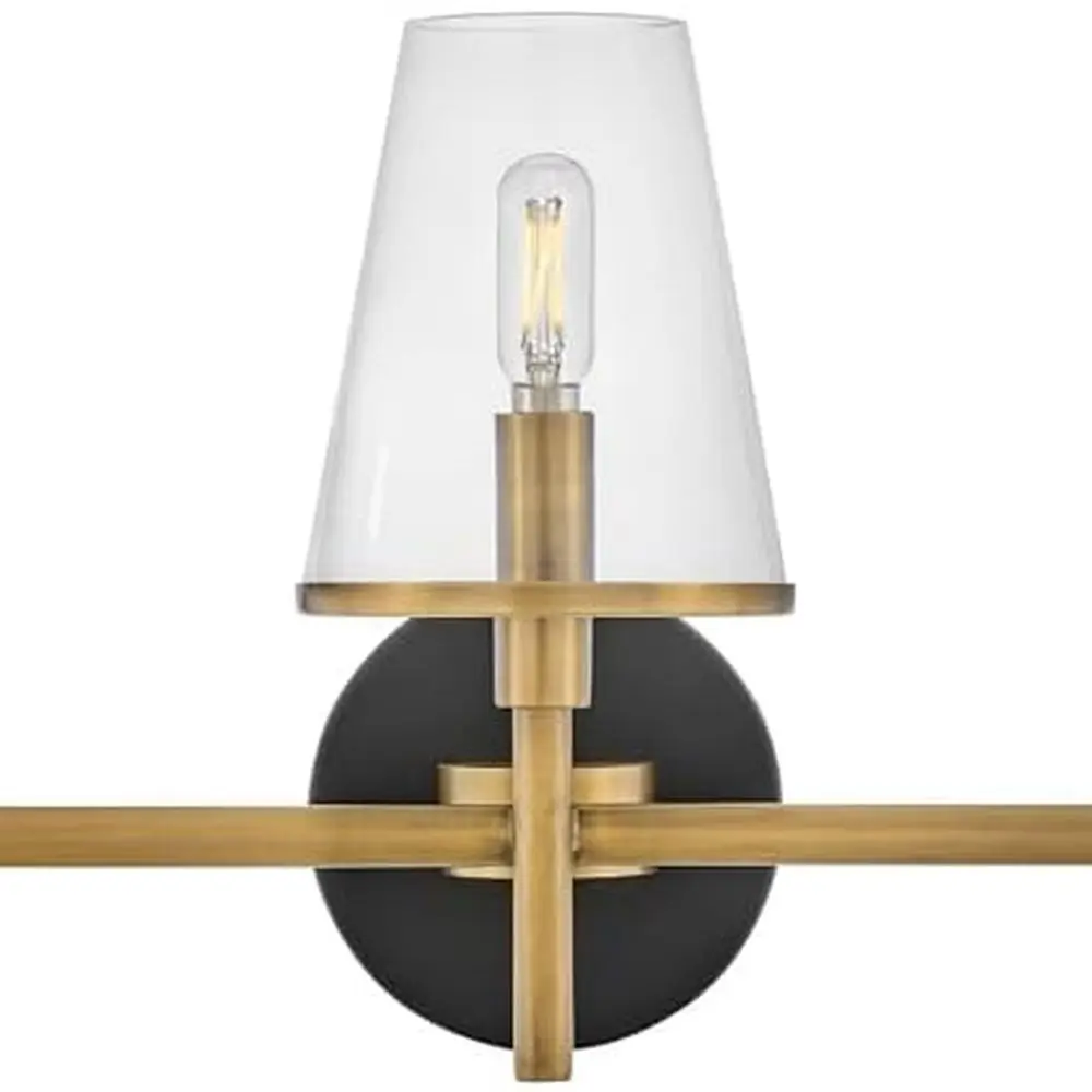 

Transitional Two-Tone 3-Light Vanity Fixture with Clear Glass Shades in Heritage Brass and Black