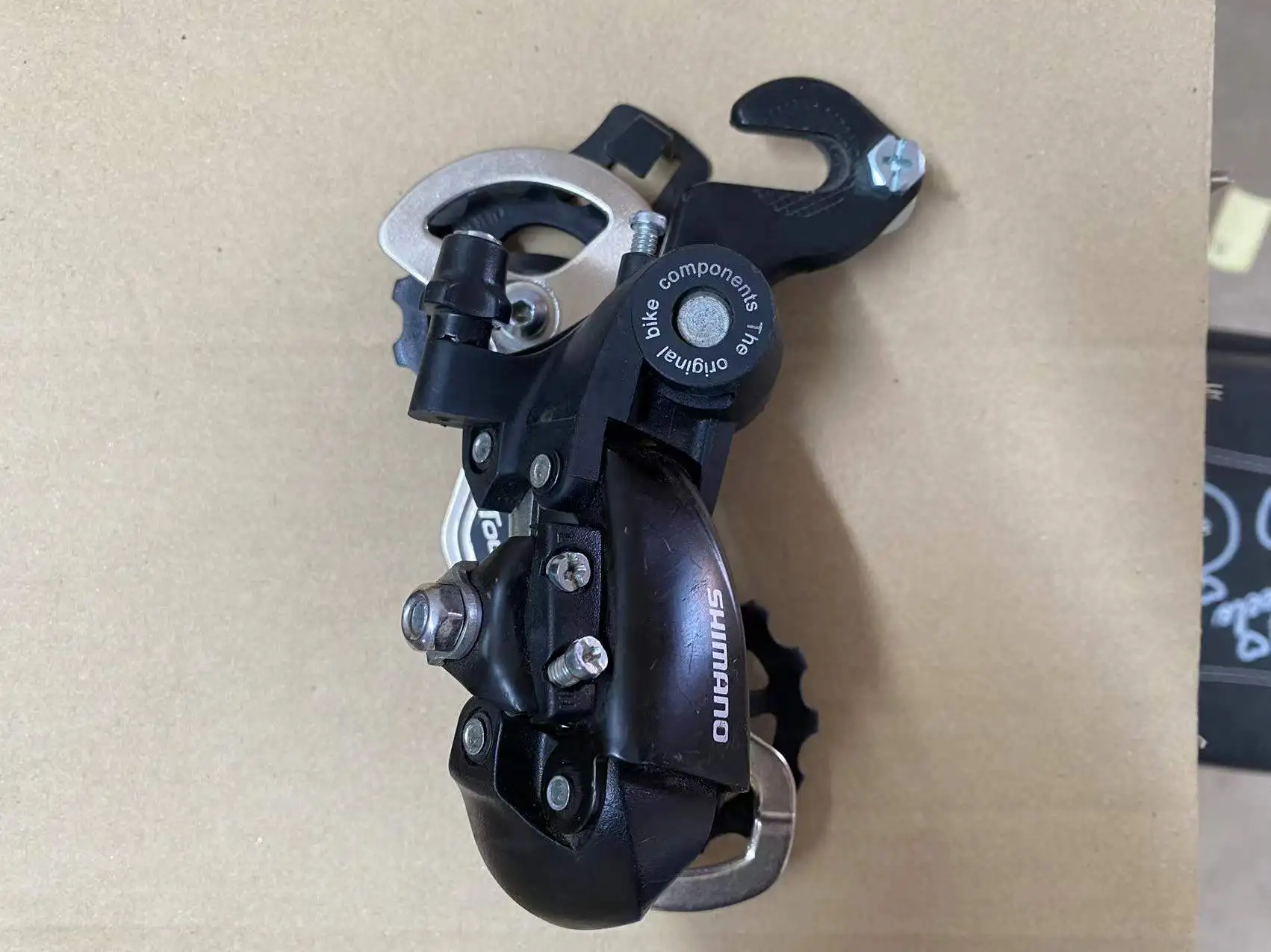 

Подходит для SHIMANO Shimano TX35, задний циферблат с защитой от крючка, совместим с 6 7, 8-скоростным маховиком, передачей, задним циферблатом, циферблатом крючка.