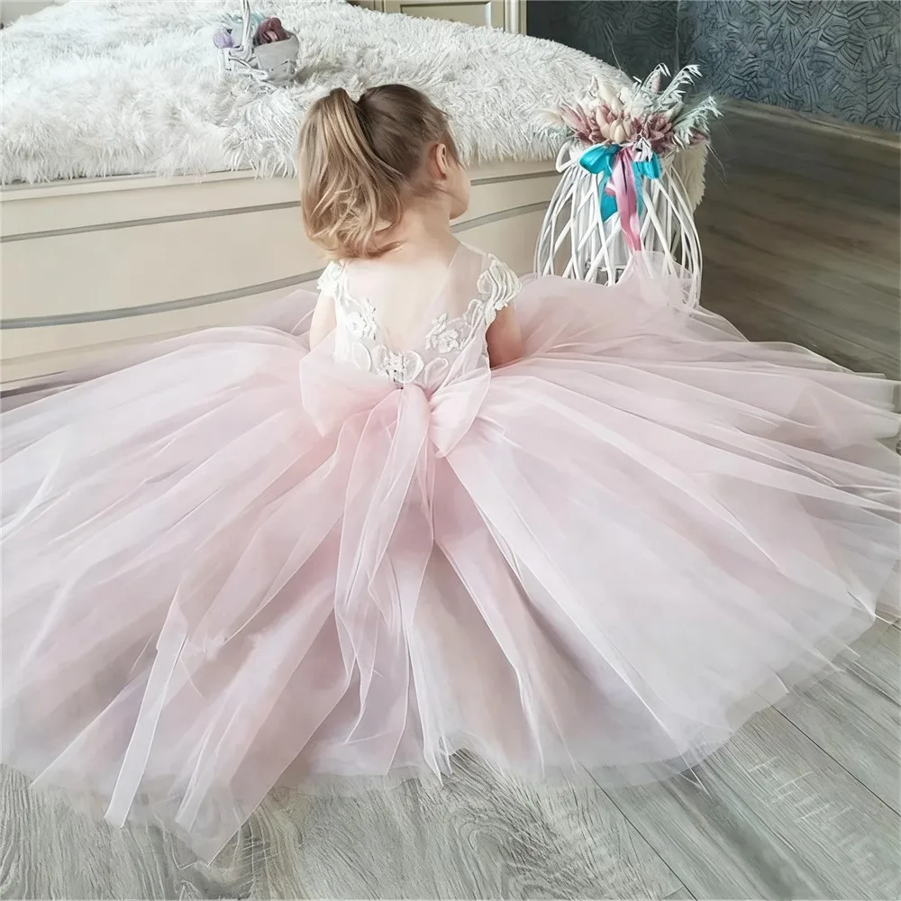 فساتين فتاة الزهور الوردية المخصصة من التول مع فيونكة بدون أكمام لحفلات الزفاف وأعياد الميلاد وحفلات التواصل الأول