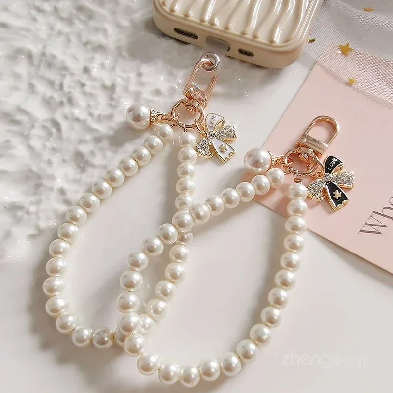 

Short Pearl Lanyards with Diamond Studded Bow Pendant Mobile Phone Lanyard Bag Key Chain Mobile Phone Charm Strap Wristband