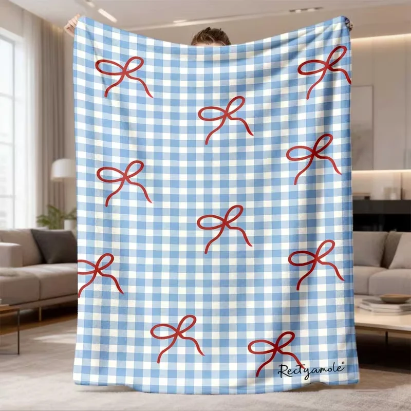 Manta acogedora con estampado de lunares y lazo rosa sobre blanket negro para sofá, decoración estética para el hogar