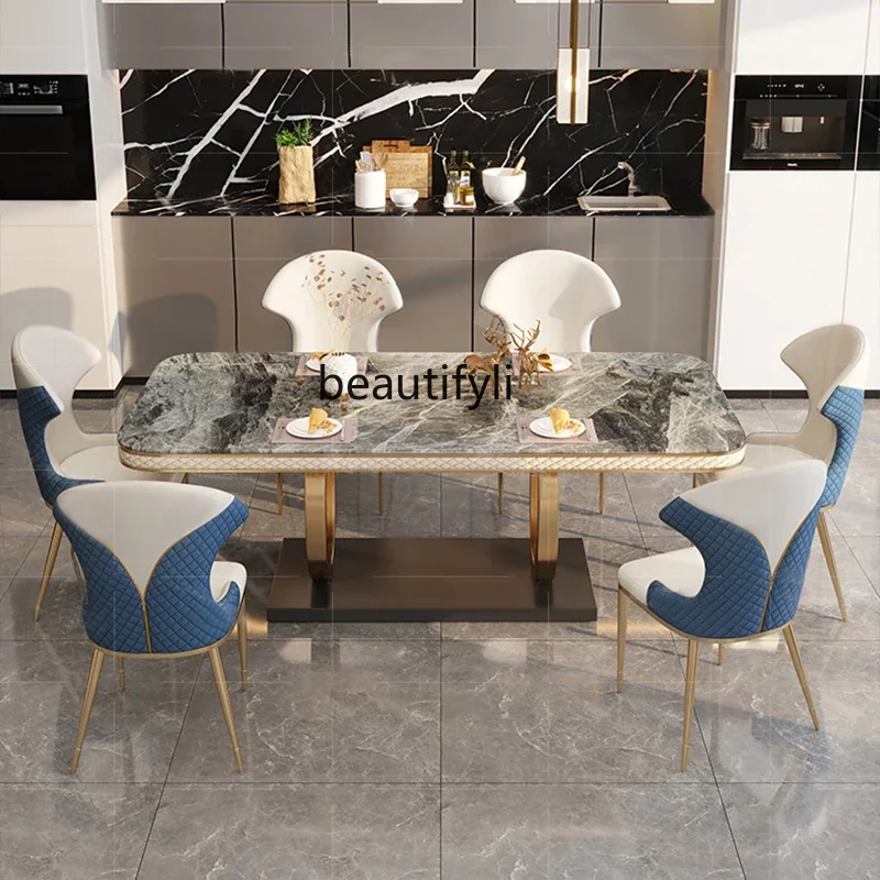 

A Bright rock slab dining table and chairs light luxury high-end rectangular stainless steel household dining table