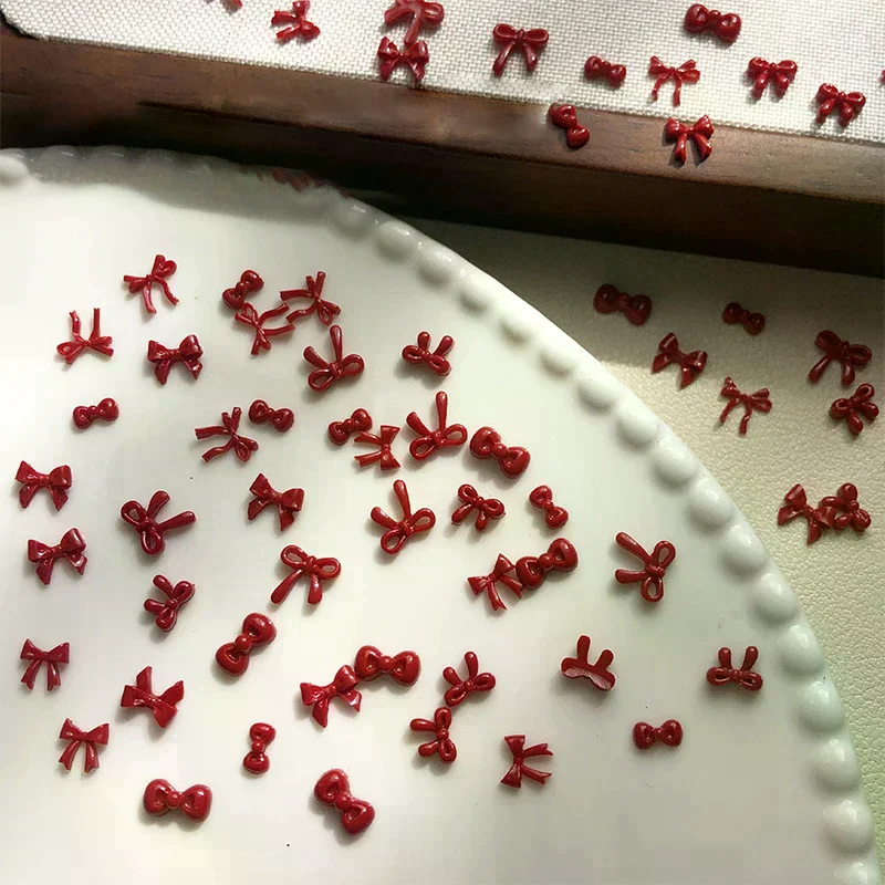 100 個 3D ネイルアート赤い弓チャーム用品かわいいアクセサリー樹脂爪の装飾製品マニキュア装飾材料ツール