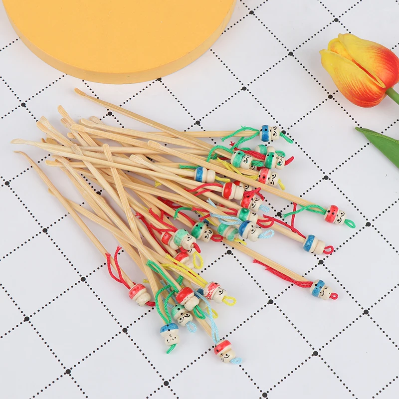 

10 pcs/lot Cartoons Cute Mini Doll Ear Picks Wood Bamboo Ear Picks Wax Remover Cleaner Ear Care Tool Random Color Hot Selling