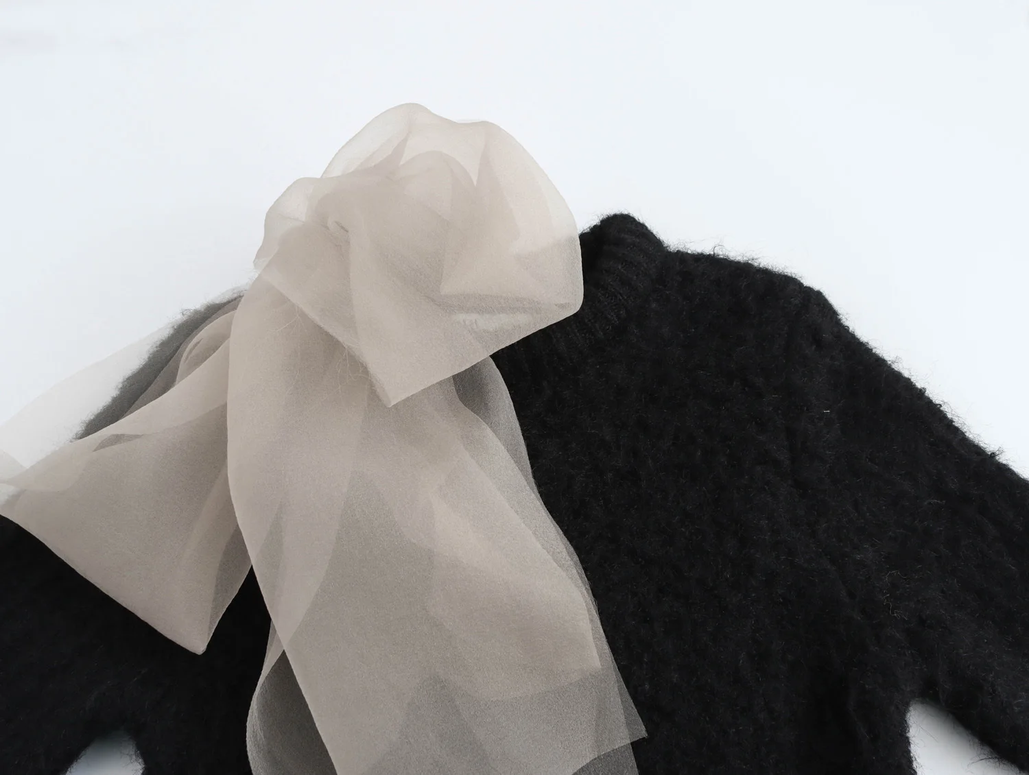 Autunno e inverno nuove donne abbigliamento dolce trasparente filato duro decorazione fiocco maglione lavorato a maglia a maniche corte