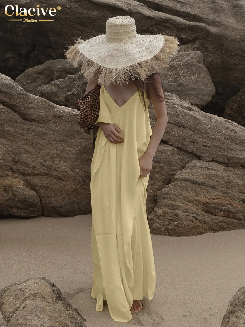 

Clacive Summer Loose Yellow Satin Women Dress 2026 Sexy Strap Sleeveless Maxi Dresses Lady Elegant Classic Ruffles Female Dress