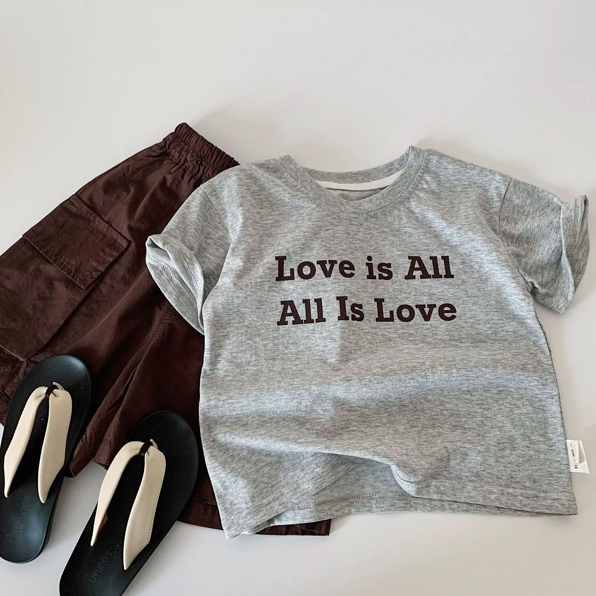 Children's Clothing Set 2026 New Summer Collection Letter Short Sleeve Top Solid Color Work Pants Two Piece Set