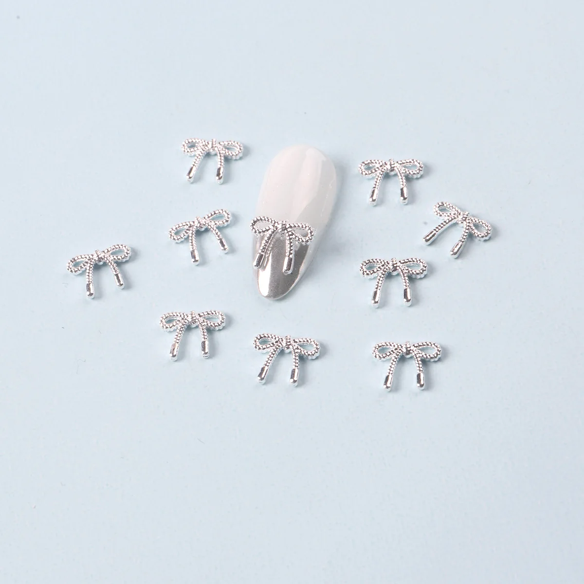 10 ピース/ロットゴールドシルバー弓ネイルチャーム合金韓国ちょう結びリボン金属アクセサリーネイルアートの装飾 DIY デザイン