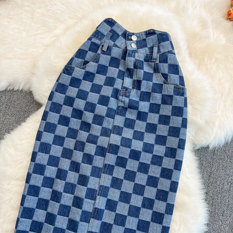 Personalità della moda Scacchiera Griglia Forcella aperta Gonna a trapezio in denim Versione coreana delle gonne sottili di media lunghezza a vita alta