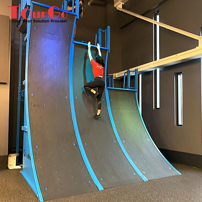 กำแพงวิ่งแบบโค้งขนาด 10 ฟุต ของ American Ninja Warrior รุ่น Mega Warped Wall ปรับแต่งได้ โครงเหล็กขนาด 15 ฟุต สำหรับผู้ใหญ่ ใช้ในสวนสาธารณะกลางแจ้ง