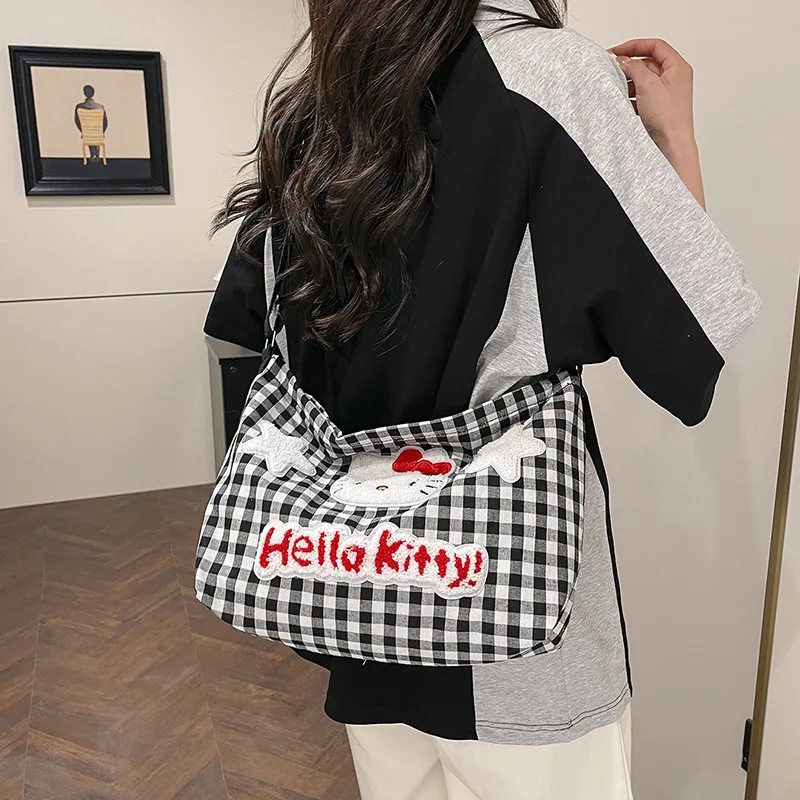 حقيبة كتف منقوشة ناعمة لطيفة من Hello Kitty للسيدات ذات سعة كبيرة وحقيبة قماش كروس للطالبات وحقيبة التنقل اليومية
