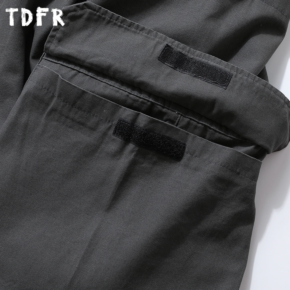 Pantalones Cargo con múltiples bolsillos para hombre, Color sólido, estilo Safari, Retro, cintura elástica, holgados, empalmados, pantalones de pierna ancha para hombre