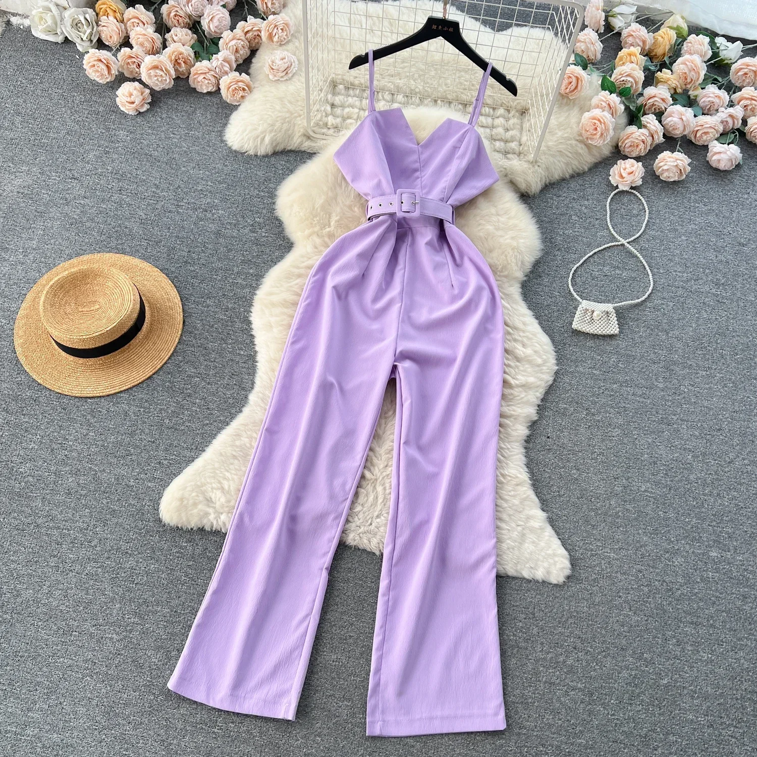 جمبسوت نسائي صيفي طويل بياقة على شكل V بدون أكمام وحزام تصميم فضفاض بأرجل واسعة موضة جديدة 2025 ملابس داخلية OL