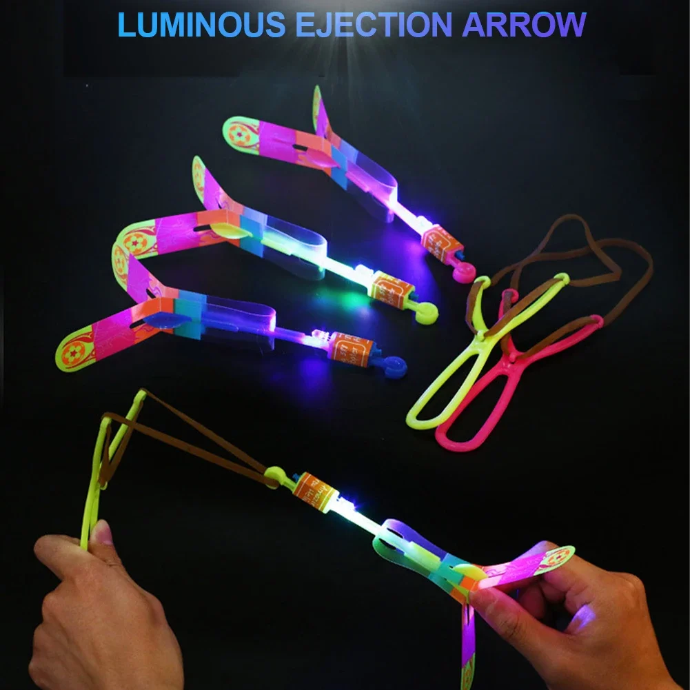 1pc Outdoor Shining Rocket Flash LED Slingshot Elastic Helicopter Rotating Flying Toy Arrow Gift Children Fairy Catapult