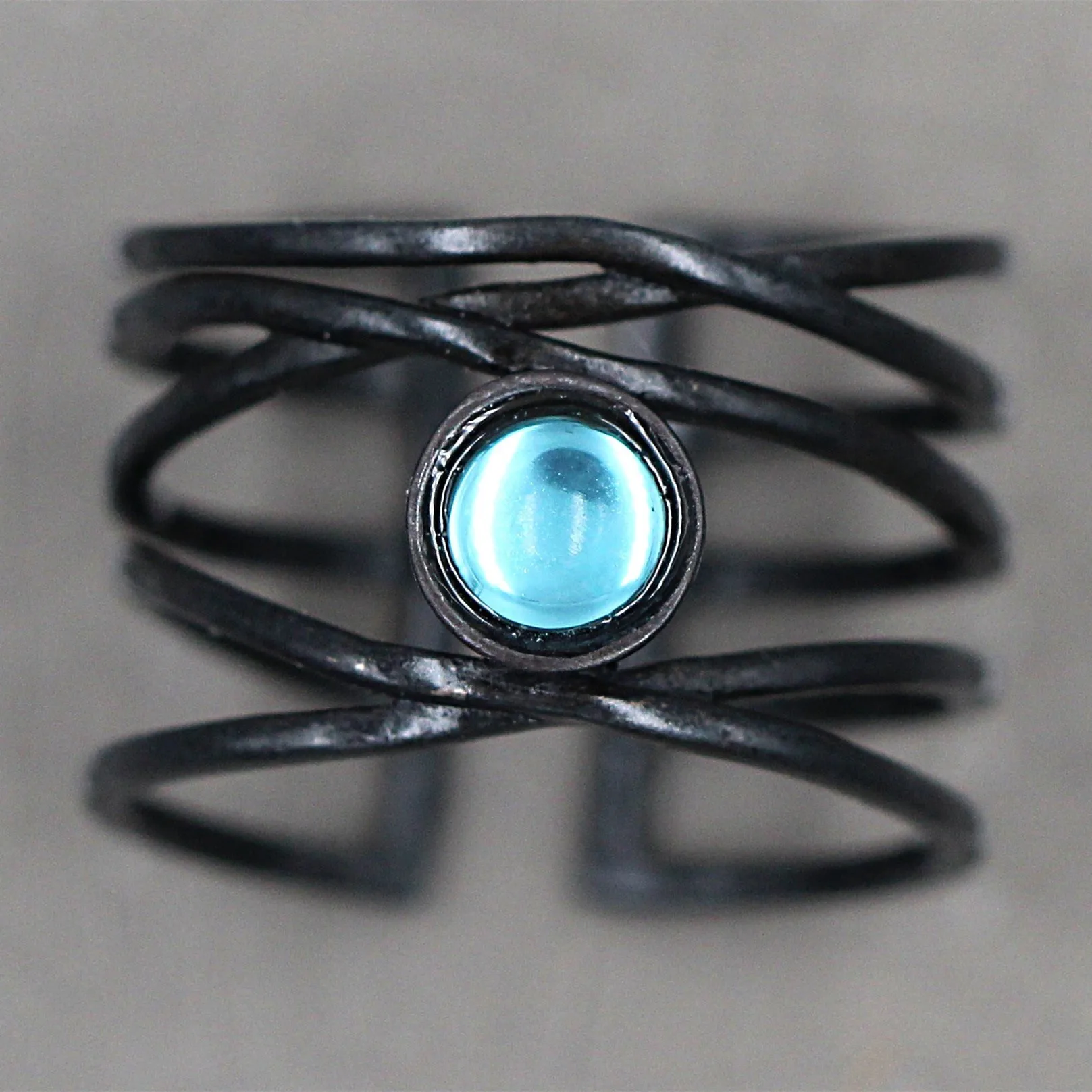 Cross-border creative abstract art line winding moonstone ring European and American exaggerated black gold open ring