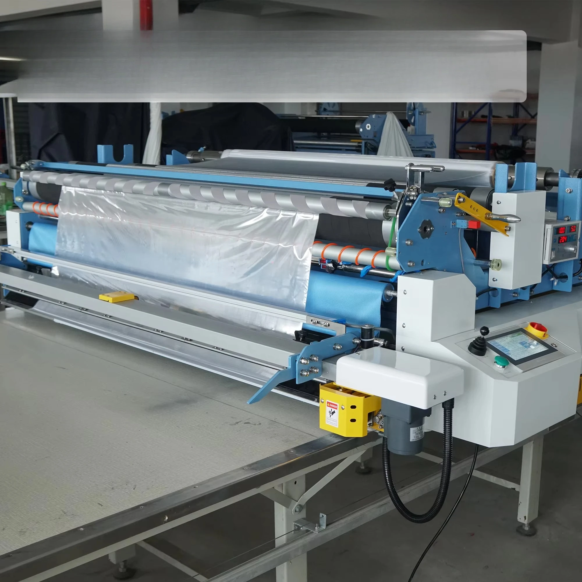 Factory Direct 1205 High Effective Intelligent CNC Automatic Cloth Spreading Machine for Polyester in Garment Factory