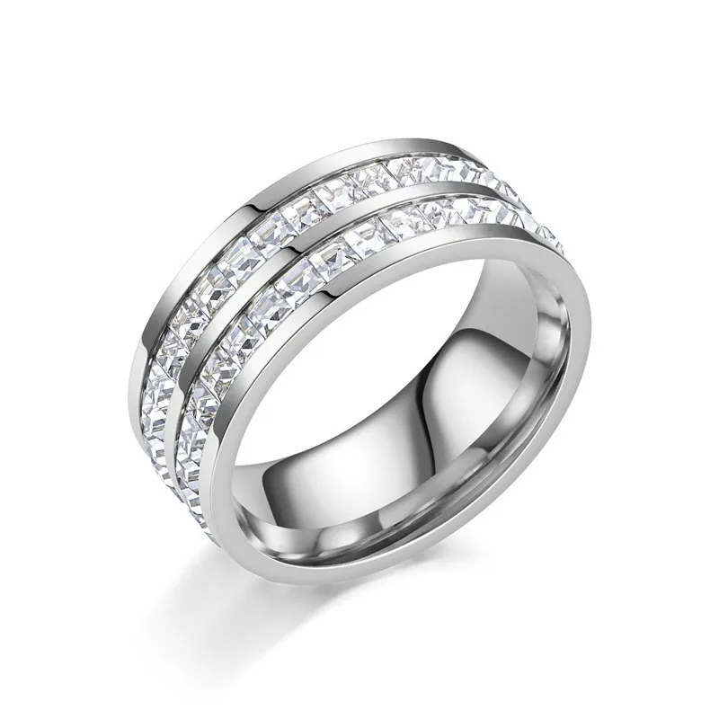 Elegant titanium steel ring featuring precision-inlaid zircon stones, available in drop, star and geometric silhouettes, offered